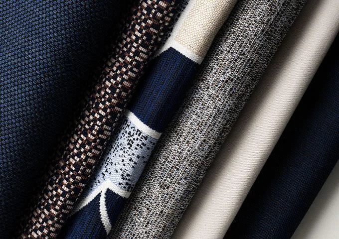 Close-up of various textured fabric swatches in different colors.
