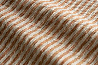 Close-up of ORANGE and white striped fabric texture