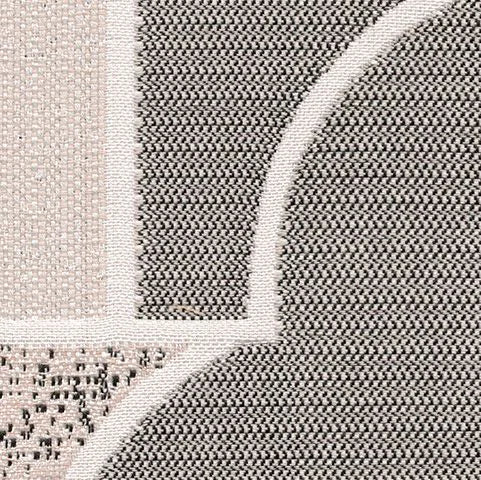 Close-up of a textured rug with geometric pattern