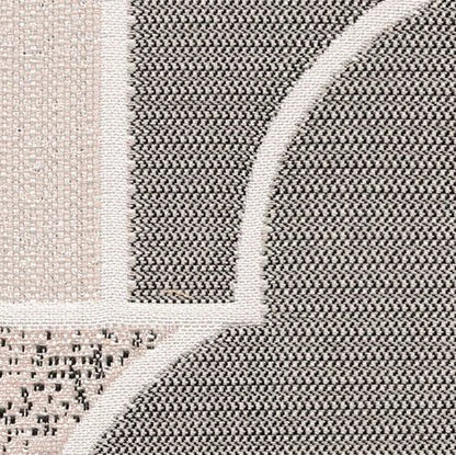Close-up of a textured rug with geometric pattern