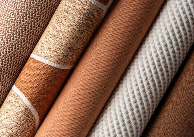 Close-up of textured fabric swatches in brown and beige tones.