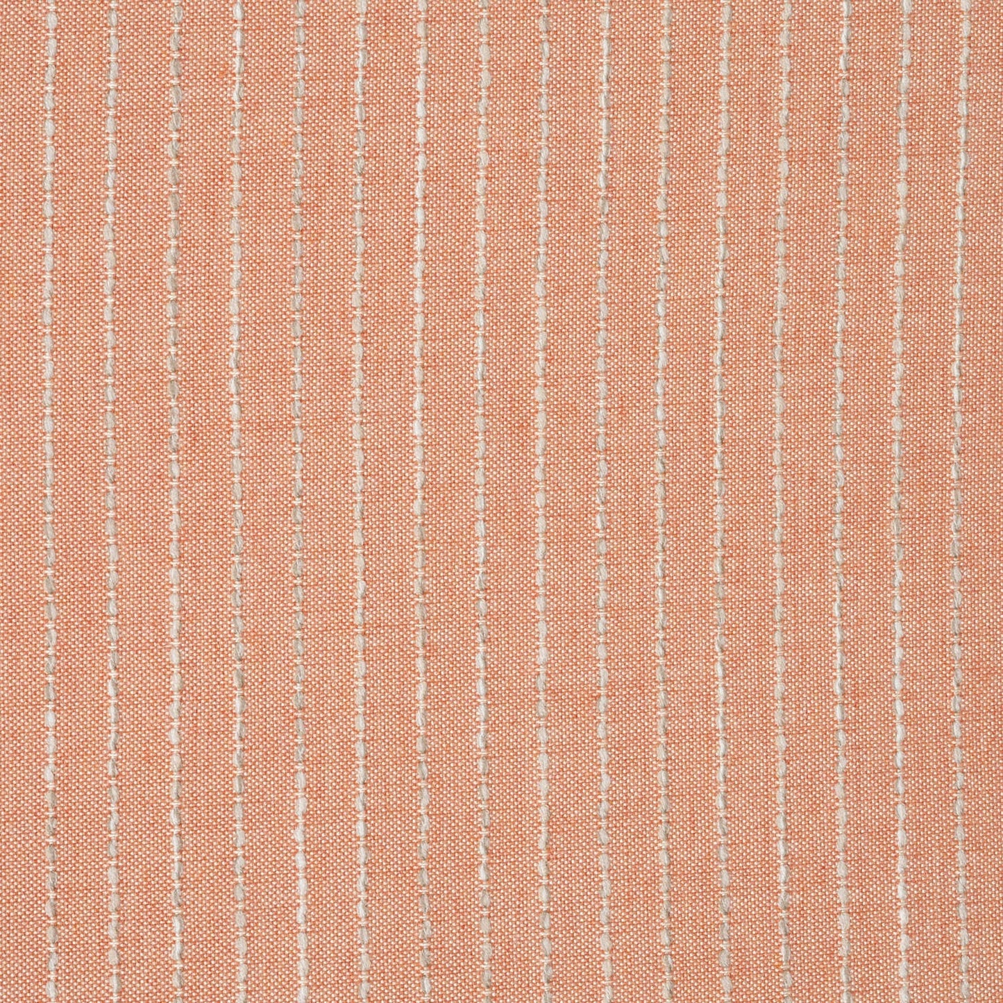 Textured fabric with thin white lines on a peach background