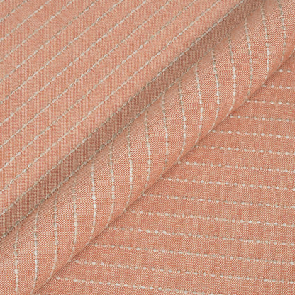 Close-up of pink fabric with subtle white stripes
