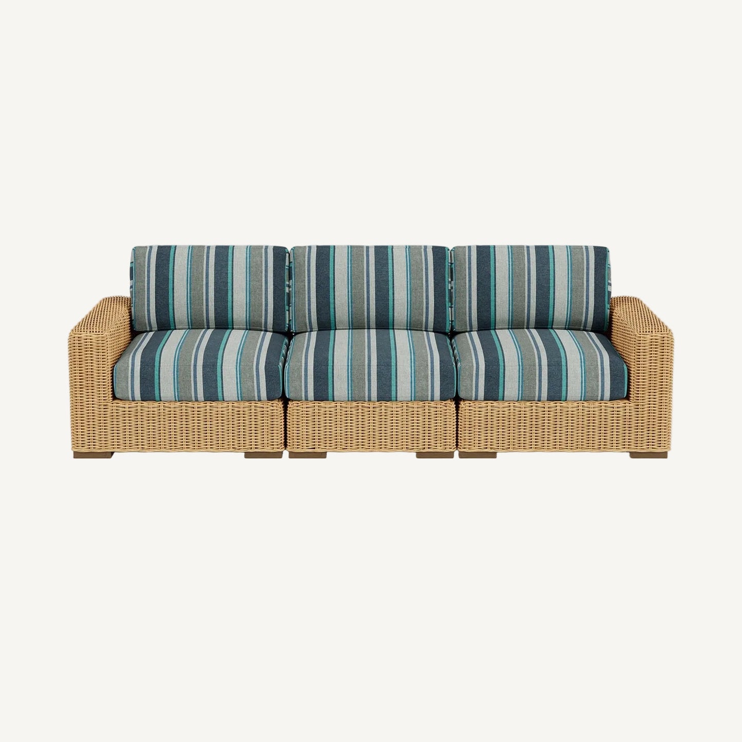 Wicker outdoor sofa with striped cushions on a white background