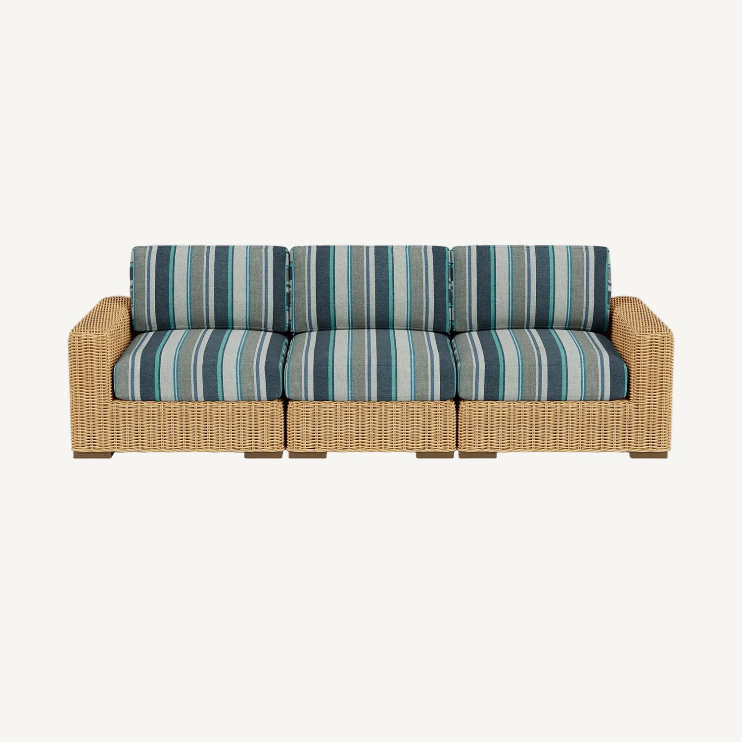 Wicker outdoor sofa with striped cushions on a white background