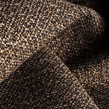 Close-up of textured brown fabric with a subtle pattern