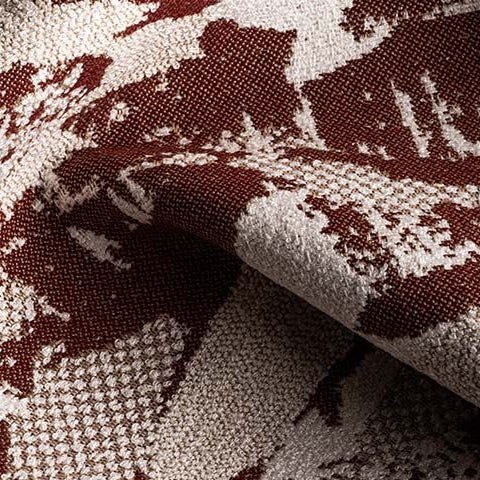 Close-up of textured fabric with brown and beige pattern